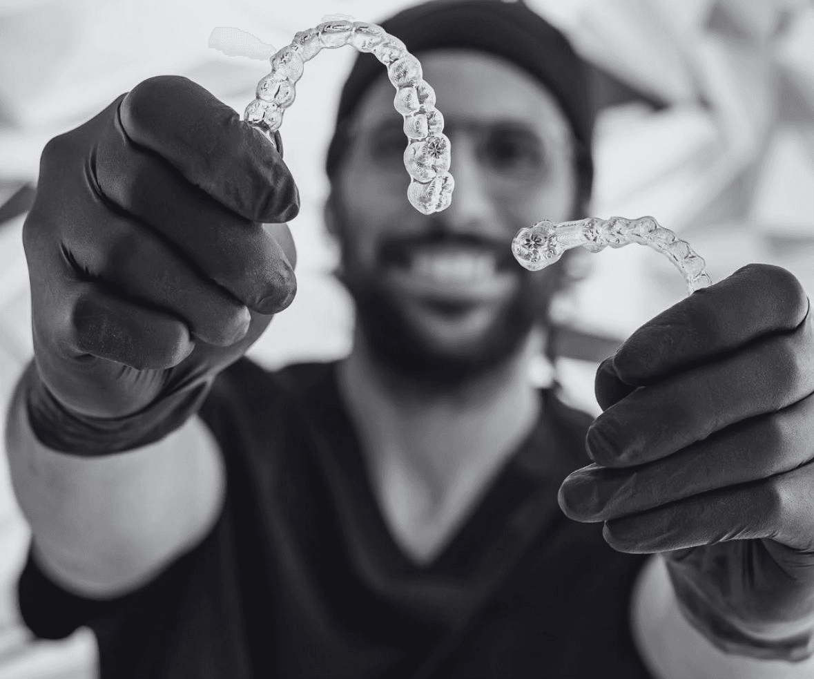 Perfect Smiles clinician showing clear dental aligners